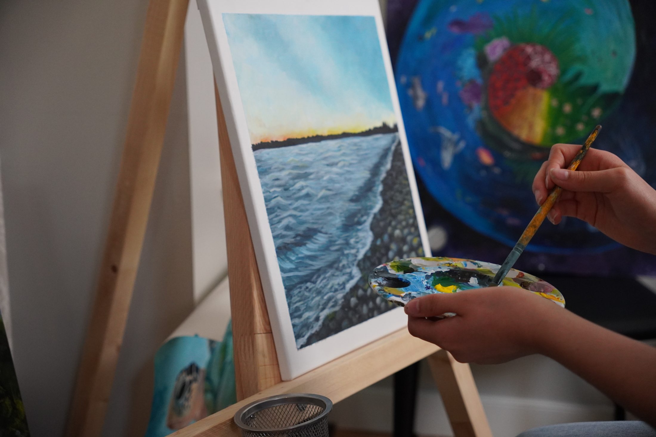 Close-up of Emma's painting process